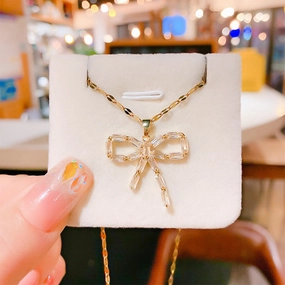 Wholesale 12pcs/pack Titanium Steel Bow Pendant Necklace Earring Set