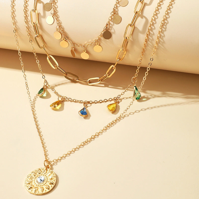 Wholesale Alloy Buckle Rhinestone Tassel Embossed Disc Pendant Necklace