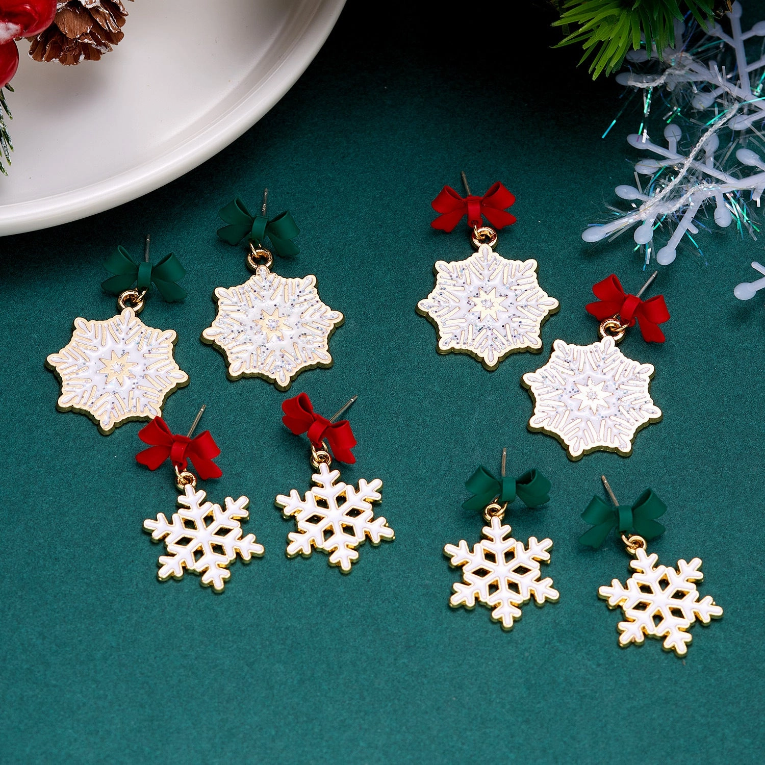 Wholesale Christmas Drip Oil Bow Knot Hollow Snowflake Alloy Earrings