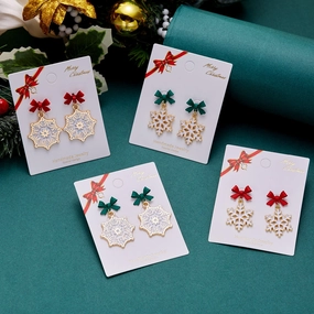 Wholesale Christmas Drip Oil Bow Knot Hollow Snowflake Alloy Earrings