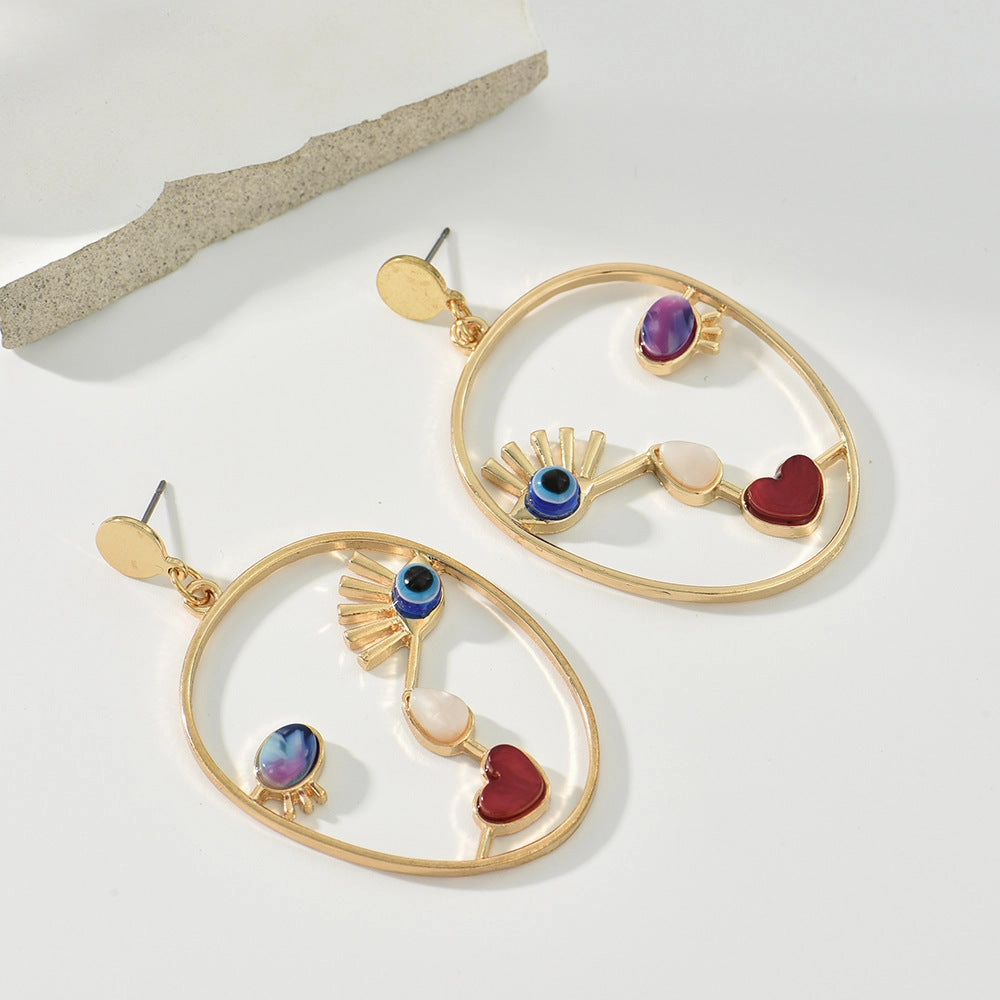 Wholesale Devil Eye Heart Face Alloy Earrings