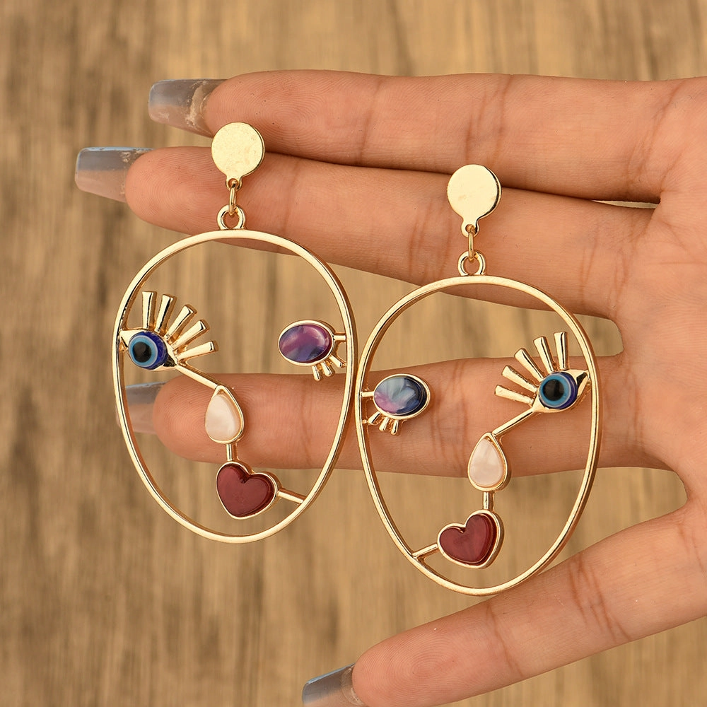 Wholesale Devil Eye Heart Face Alloy Earrings