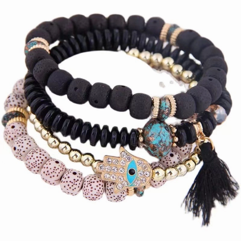Wholesale Evil Blue Eyes Tassel Alloy Bracelet