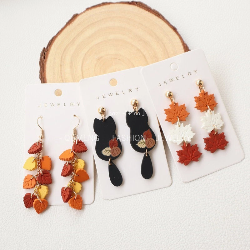 Wholesale Imitation Soft Pottery Hand Feel Spray Painted Acrylic Cat Maple Leaf Earrings