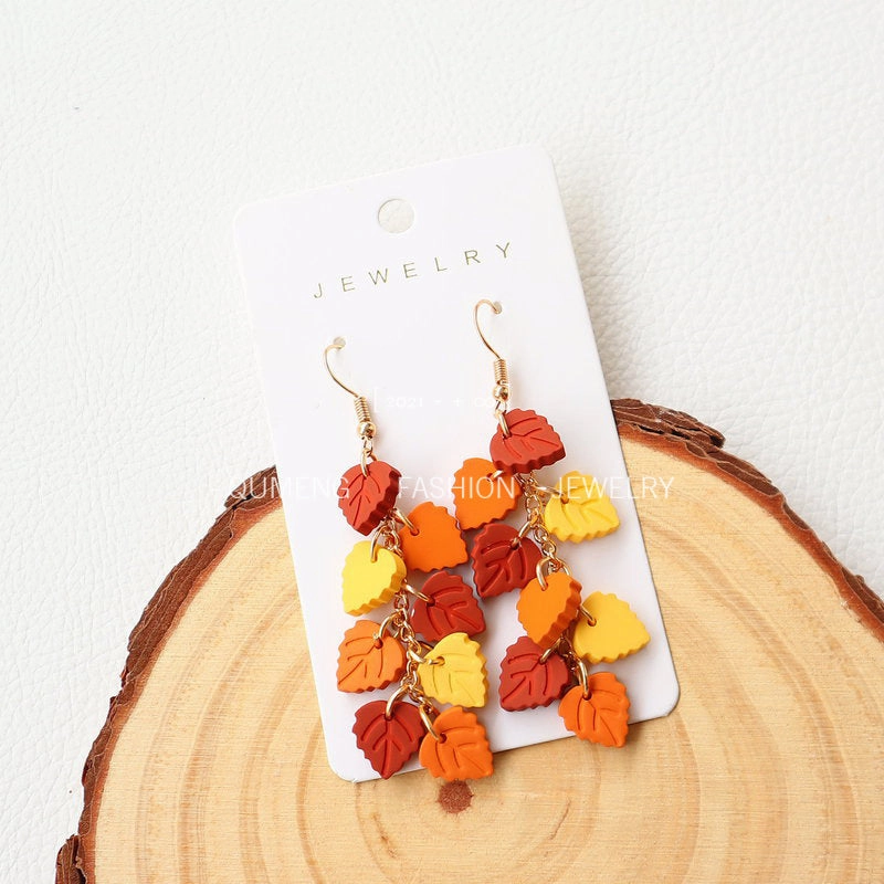 Wholesale Imitation Soft Pottery Hand Feel Spray Painted Acrylic Cat Maple Leaf Earrings
