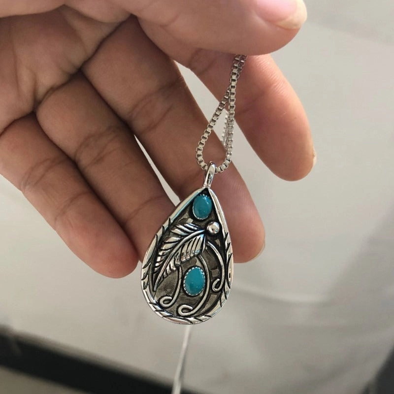 Wholesale Inlaid Turquoise Retro Dyed Black Feather Alloy Pendants