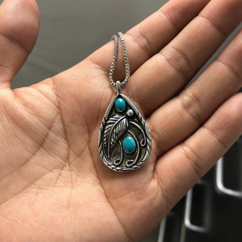 Wholesale Inlaid Turquoise Retro Dyed Black Feather Alloy Pendants