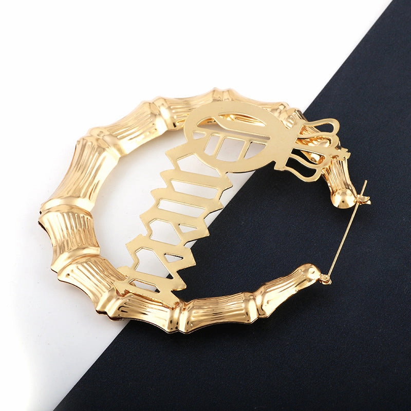 Wholesale Punk English Alphabet Queen Slub Round Metal Earrings