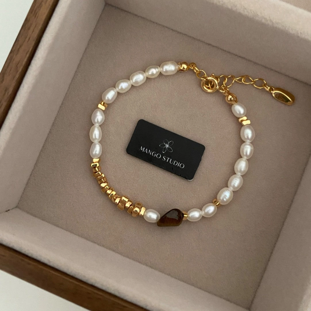 Wholesale Rice-grain pearl tiger eye stone small fresh and high-end adjustable bracelet