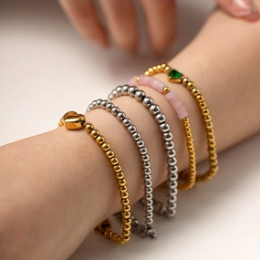 Wholesale Titanium Steel 16k Gold Bead Green Heart Zircon Bracelet