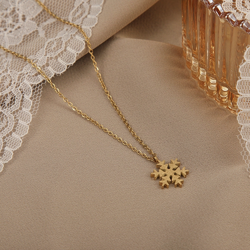 Wholesale Titanium Steel Color Gold Frosted Small Snowflake Necklace