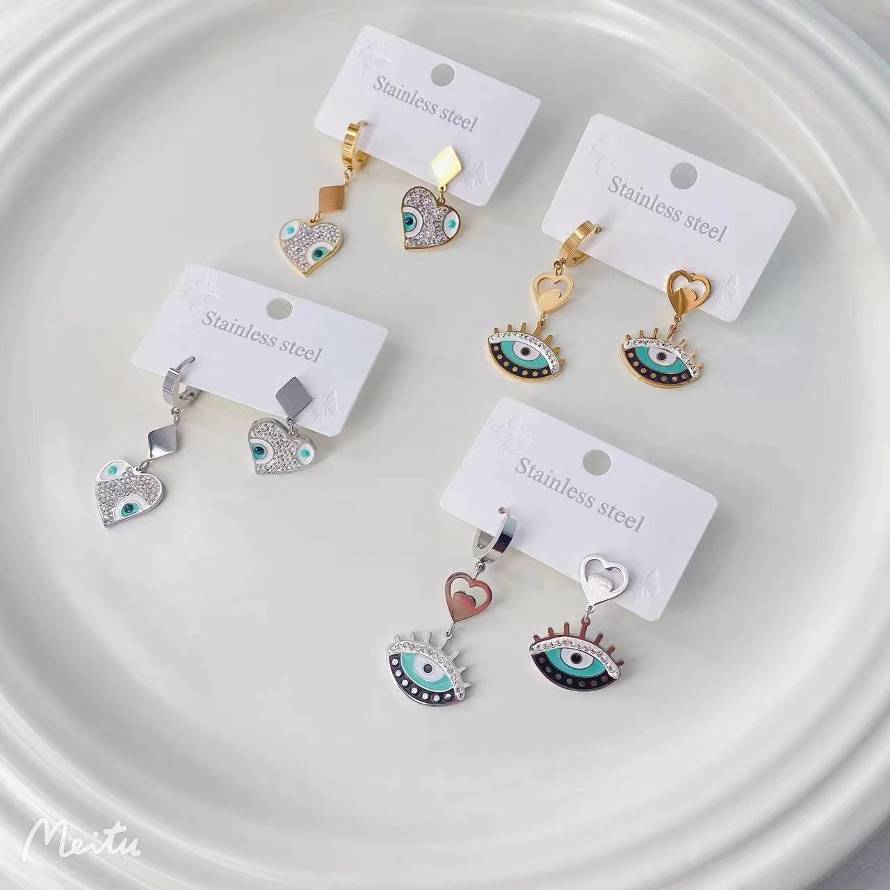 Wholesale Titanium Steel Devil's Eye Colored Painted Diamond Hollow Earrings