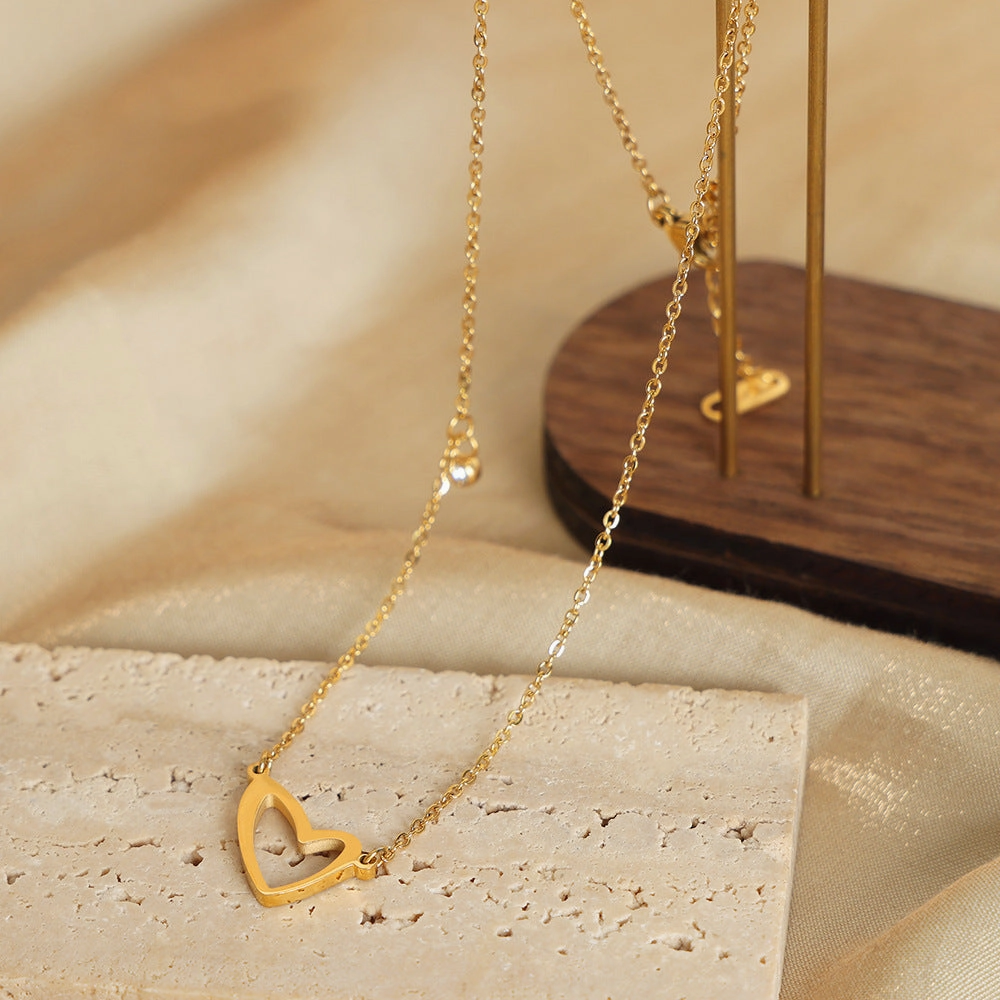 Wholesale Valentine's Day Titanium Steel 18k Gold Asymmetric Hollow Heart Pendant Necklace