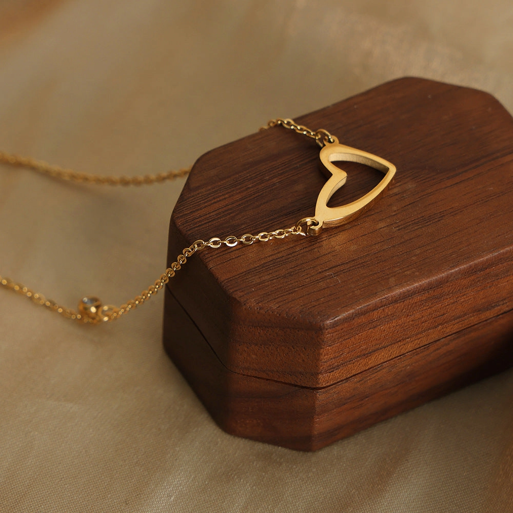 Wholesale Valentine's Day Titanium Steel 18k Gold Asymmetric Hollow Heart Pendant Necklace