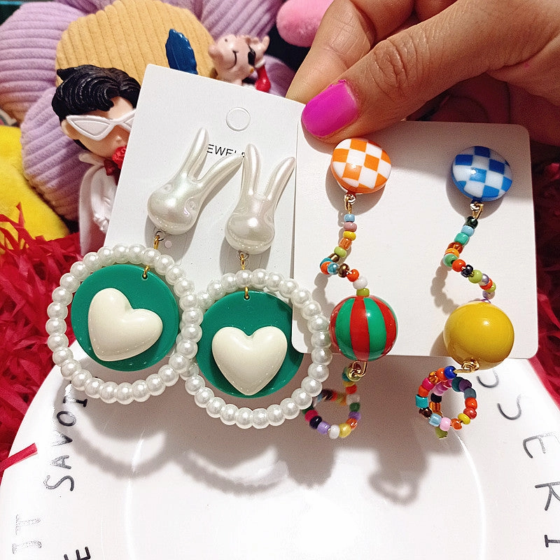 Wholesale Wholesale S925 curved candy beads pearl rabbit girlish cartoon silver earrings